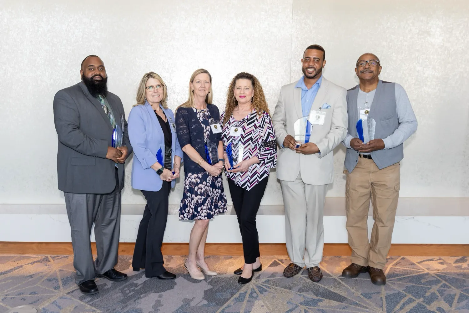 CMC team members celebrating recognition at a company event
