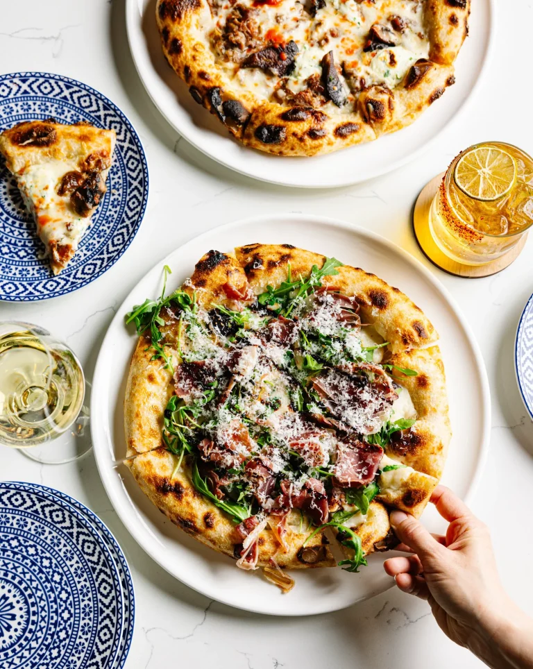 Wood-fired pizzas served with cocktails