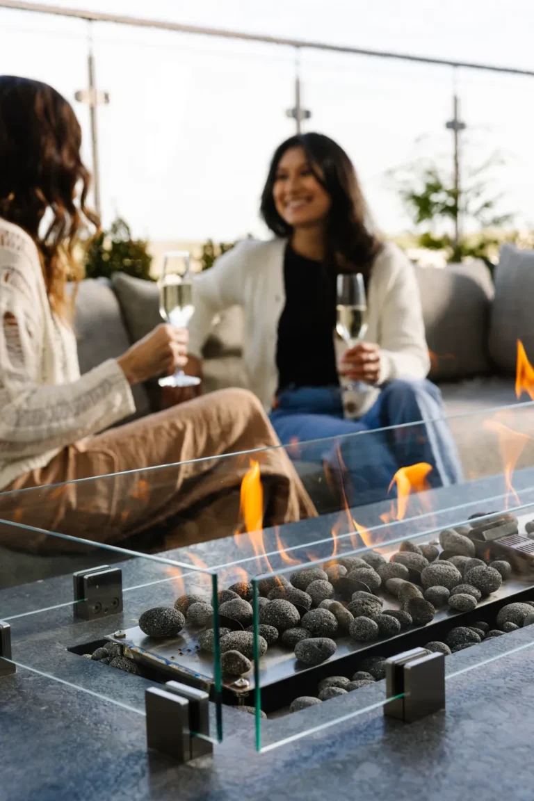 Guests gathering around an outdoor fire