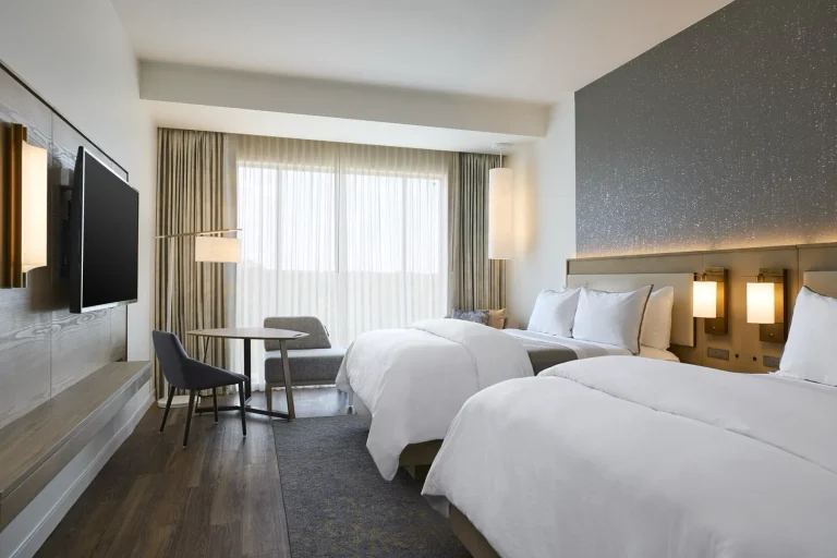 A bright Westin guest room with two beds