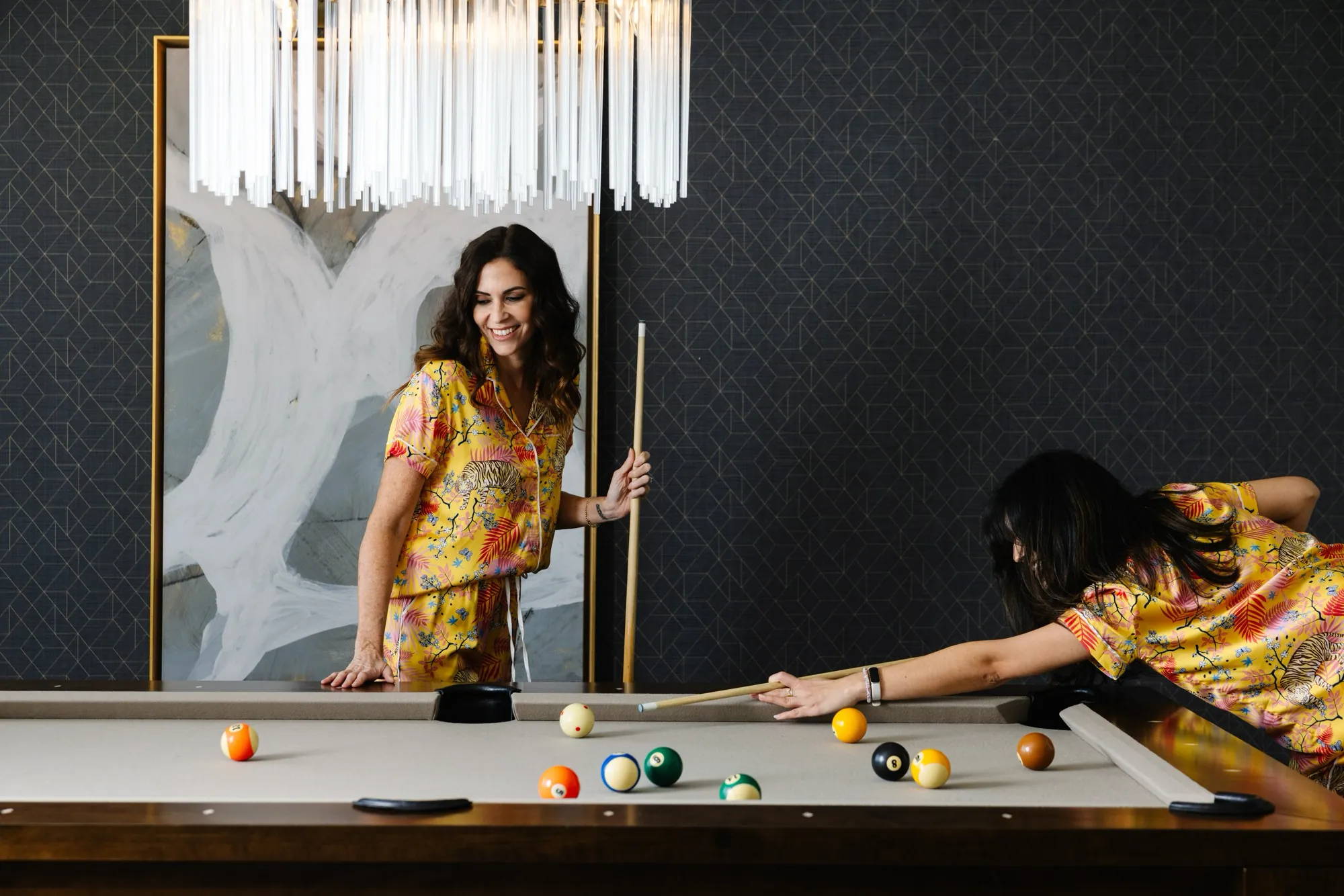 Friends enjoying a game of pool at The Westin